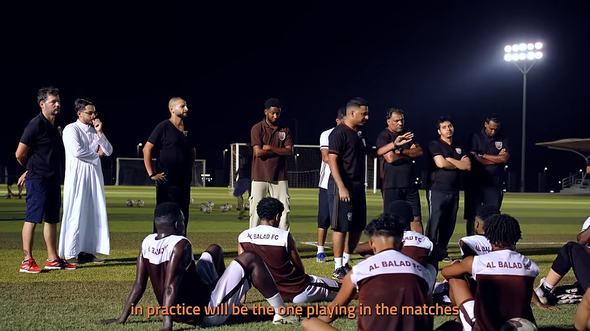 Players receive instructions from the coach